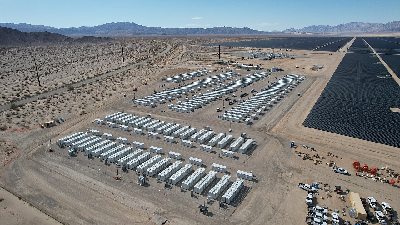 Rows of grid-scale battery storage containers at a utility energy-storage site