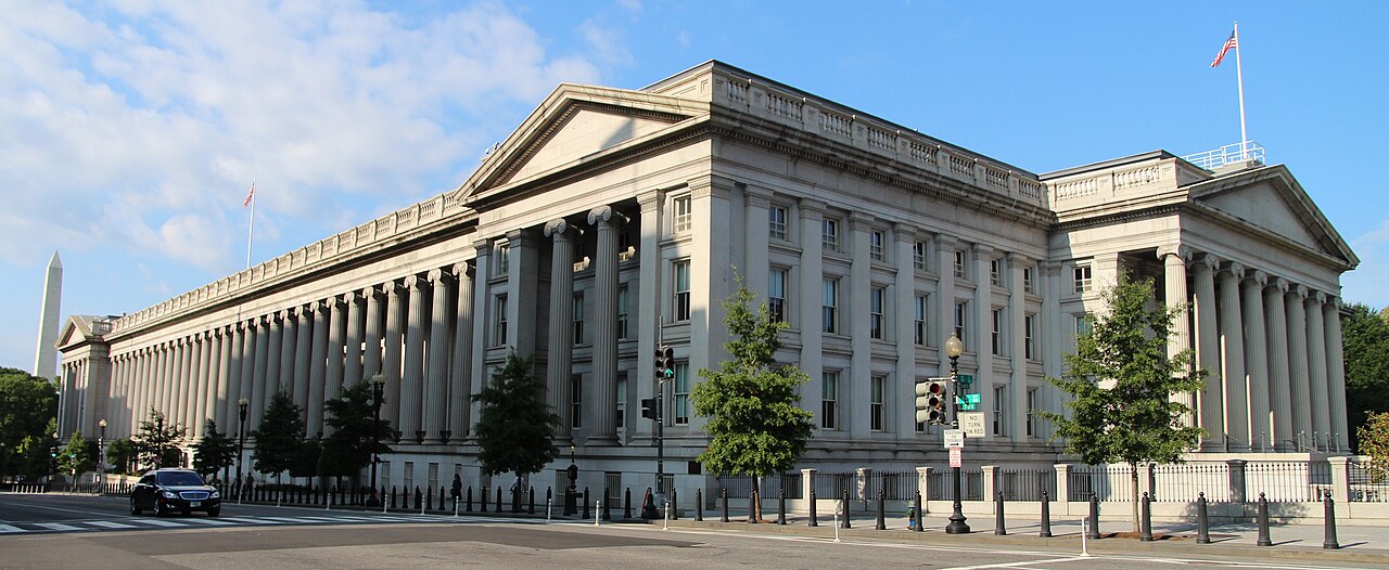 The neoclassical facade and columns of the United States Treasury Building in Washington, D.C.